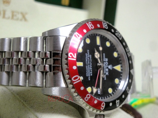 Rolex replica GMT master II vintage plexy 1675 rosso nero jubilèè orologio replica imitazione - immagine 7
