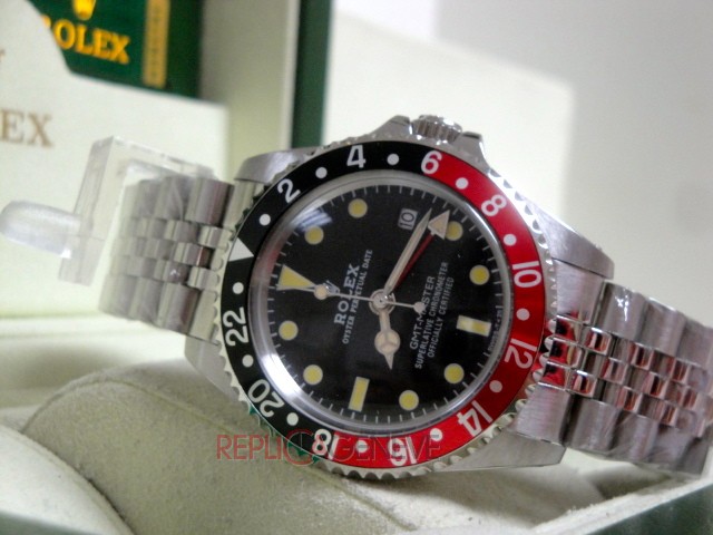 Rolex replica GMT master II vintage plexy 1675 rosso nero jubilèè orologio replica imitazione - immagine 13